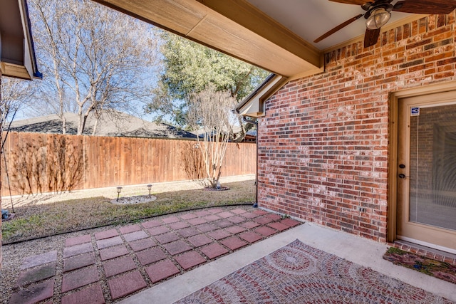 view of patio featuring ceiling fan