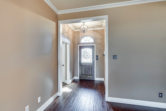 entryway featuring dark hardwood / wood-style flooring, an inviting chandelier, and ornamental molding