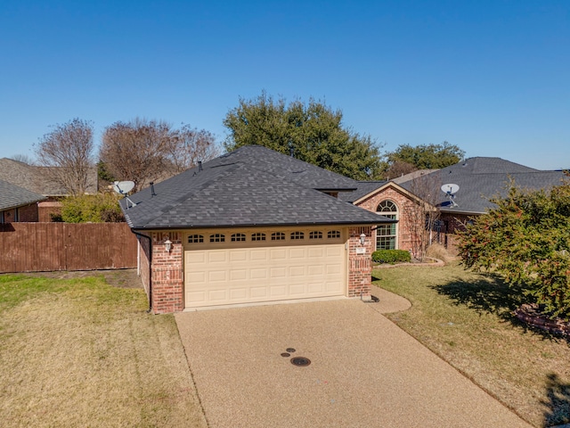 ranch-style house featuring a garage and a front lawn