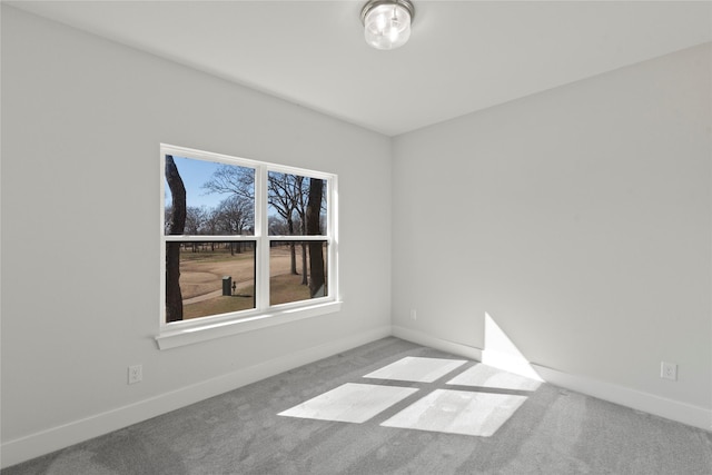 spare room with light carpet