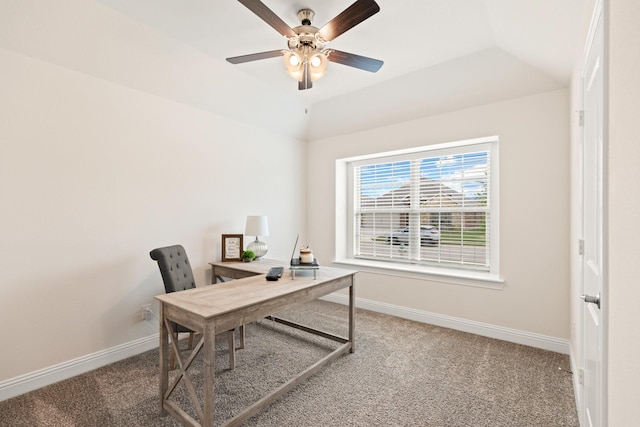 office area featuring ceiling fan, carpet floors, and lofted ceiling