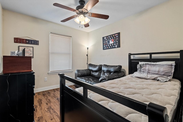 bedroom with wood-type flooring and ceiling fan