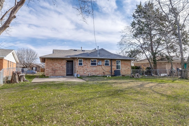 back of house with a patio, central AC, and a yard