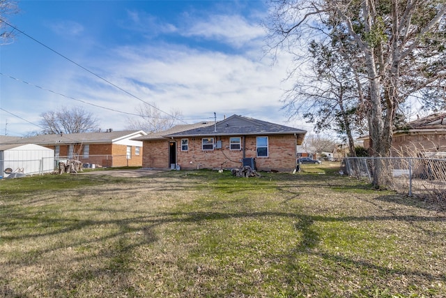 back of property featuring a yard