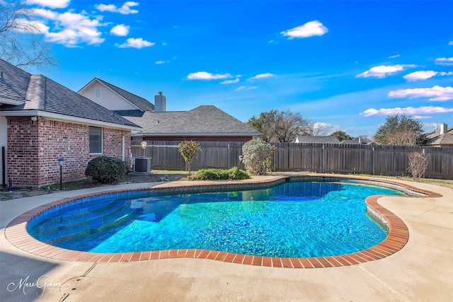 view of swimming pool with central AC and a patio