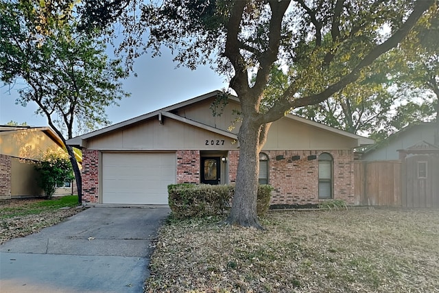 ranch-style home with a garage