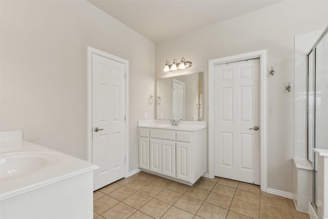 bathroom featuring vanity, an enclosed shower, and tile patterned flooring