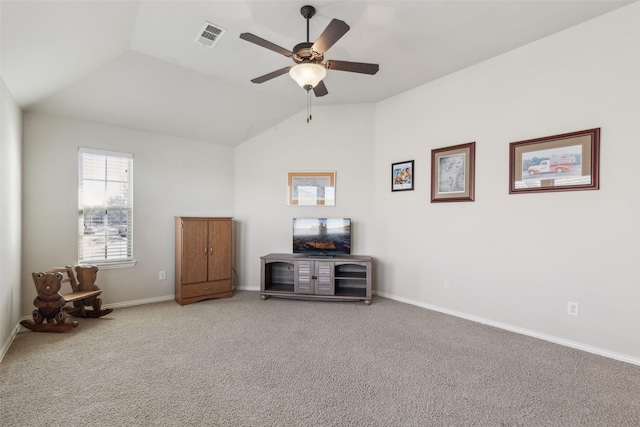 interior space featuring ceiling fan, lofted ceiling, and carpet