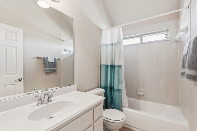 full bathroom featuring lofted ceiling, toilet, shower / tub combo, and vanity