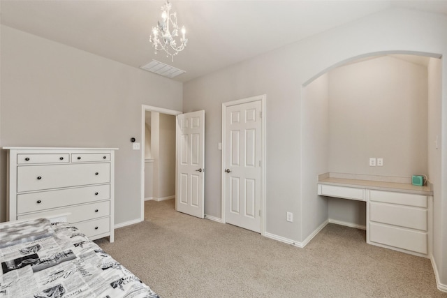 unfurnished bedroom featuring an inviting chandelier and light colored carpet