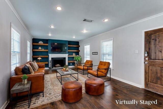 spare room with dark wood-type flooring, ornamental molding, and ceiling fan