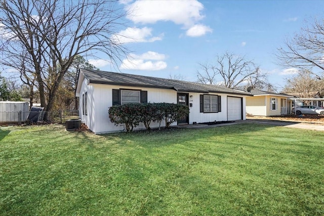 ranch-style house with cooling unit, a garage, and a front lawn