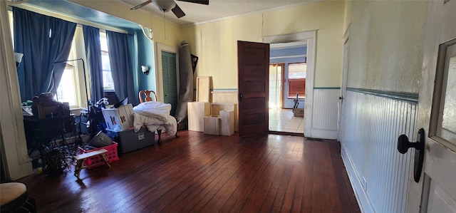 bedroom with ceiling fan and dark hardwood / wood-style flooring