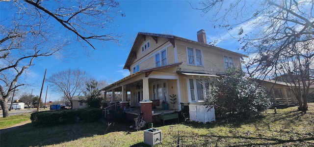 view of property exterior featuring a lawn and a porch