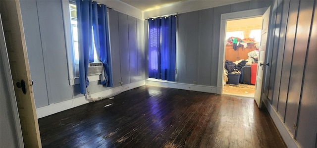 unfurnished room with dark wood-type flooring and cooling unit