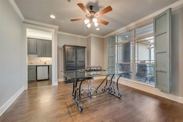 office space featuring dark hardwood / wood-style flooring, ceiling fan, and ornamental molding