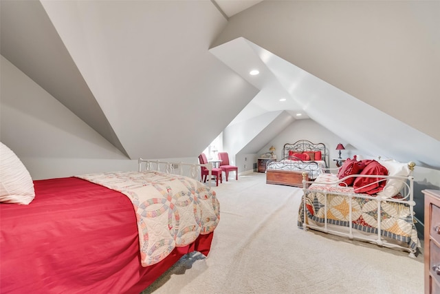 carpeted bedroom with lofted ceiling