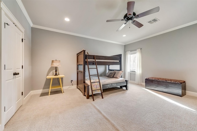 carpeted bedroom with ceiling fan and crown molding