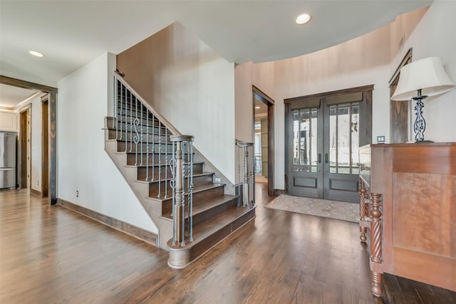 entryway featuring hardwood / wood-style floors and french doors