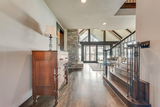 corridor featuring vaulted ceiling and dark wood-type flooring