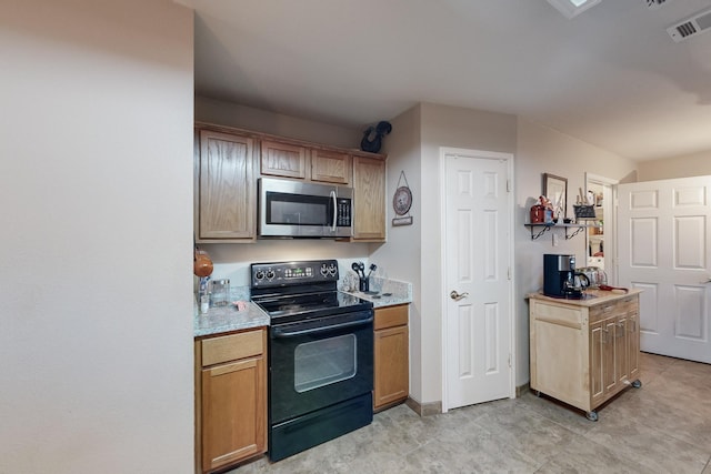 kitchen featuring black range with electric cooktop