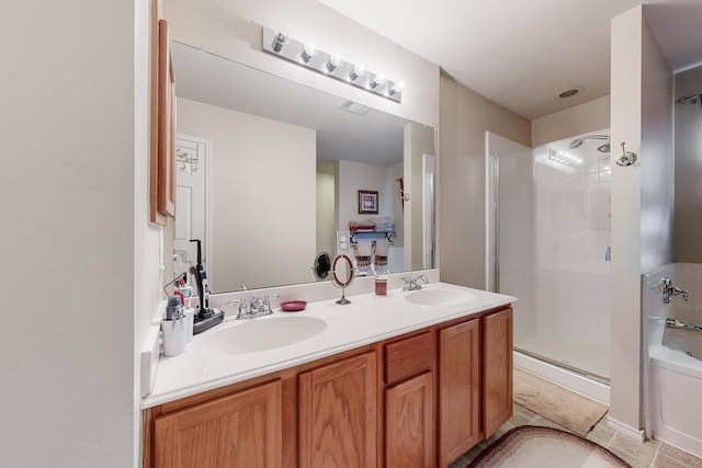 bathroom featuring tile patterned floors, vanity, and an enclosed shower