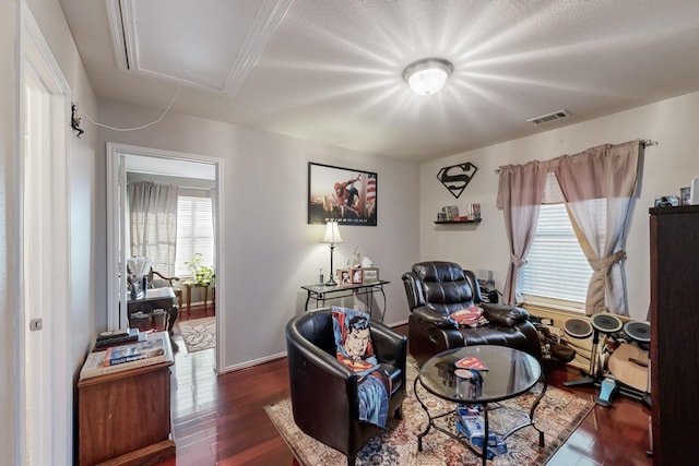 sitting room with dark hardwood / wood-style flooring