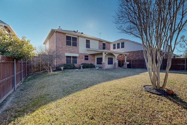 rear view of house with a lawn