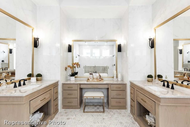 bathroom featuring vanity and tile walls