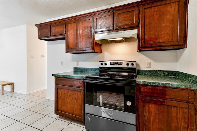 kitchen featuring light tile patterned floors and stainless steel electric range