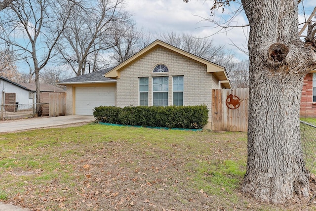 view of front of house with a garage and a front lawn