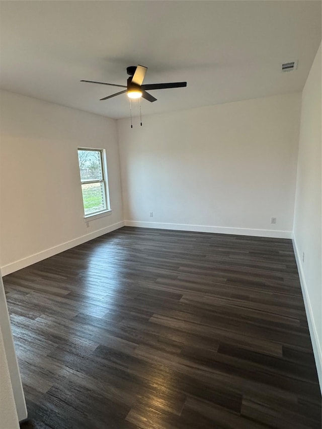 unfurnished room featuring dark hardwood / wood-style flooring and ceiling fan