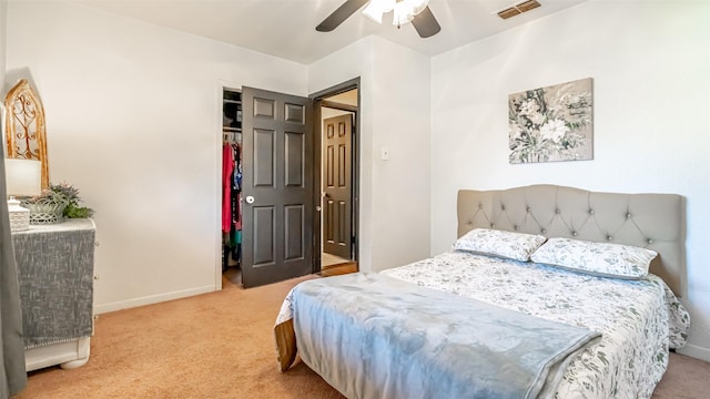 carpeted bedroom with a closet and ceiling fan