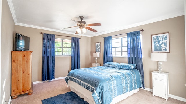 carpeted bedroom with ceiling fan and ornamental molding