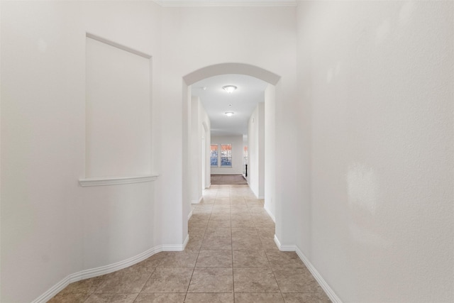 hall featuring light tile patterned floors