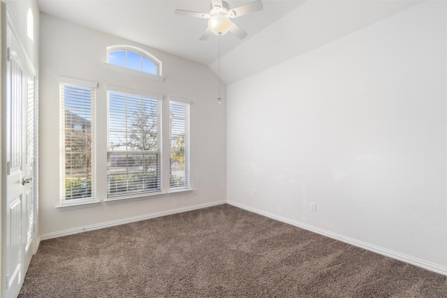 carpeted empty room with ceiling fan and lofted ceiling