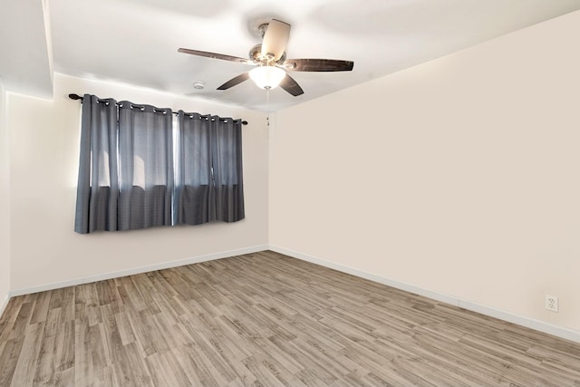 unfurnished room featuring light wood-type flooring and ceiling fan