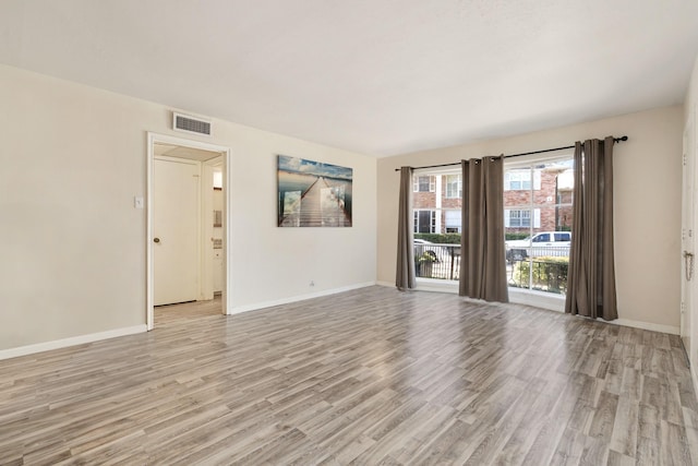 spare room featuring light hardwood / wood-style flooring