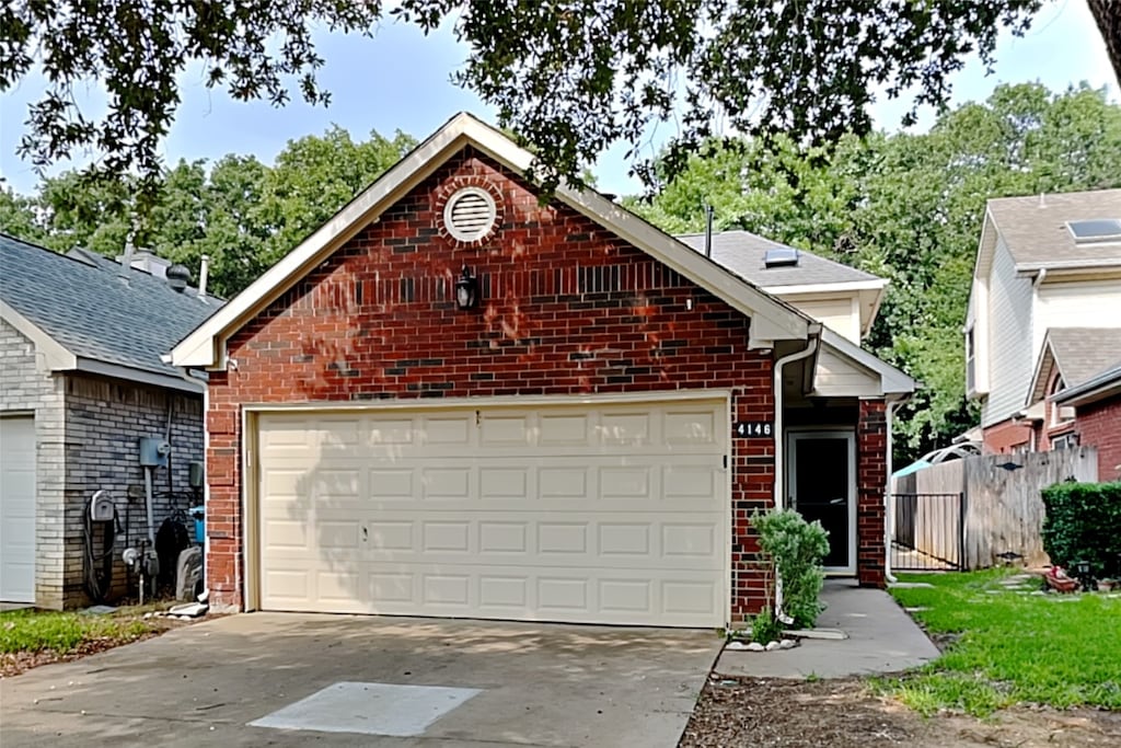 view of property with an outdoor structure and a garage