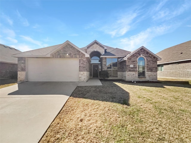 single story home with a garage and a front yard