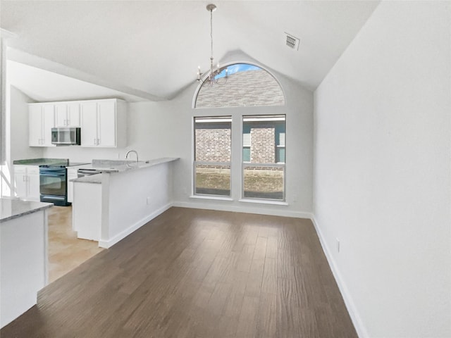 kitchen with decorative light fixtures, white cabinetry, black range with electric cooktop, light hardwood / wood-style floors, and kitchen peninsula