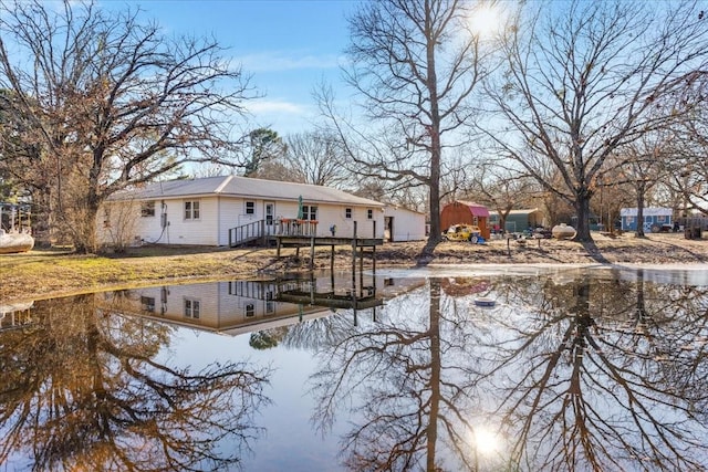 rear view of house with a water view