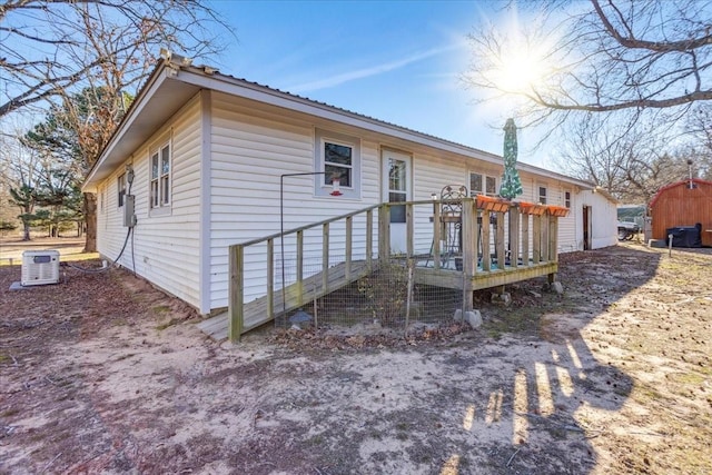 back of property featuring a deck