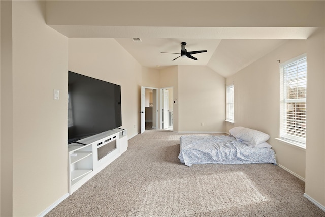 bedroom with ceiling fan, carpet flooring, and vaulted ceiling