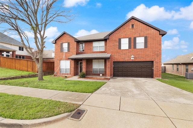 view of front of property with a front yard and a garage