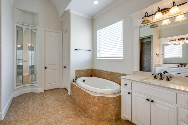 bathroom featuring plus walk in shower, vanity, and ornamental molding