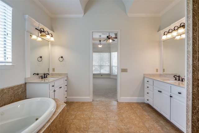 bathroom featuring vanity, ornamental molding, and a relaxing tiled tub