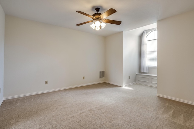 carpeted empty room with ceiling fan