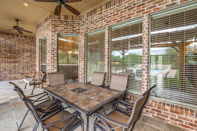 view of patio featuring ceiling fan