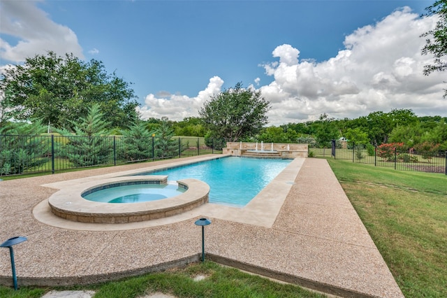 view of swimming pool with an in ground hot tub and a yard